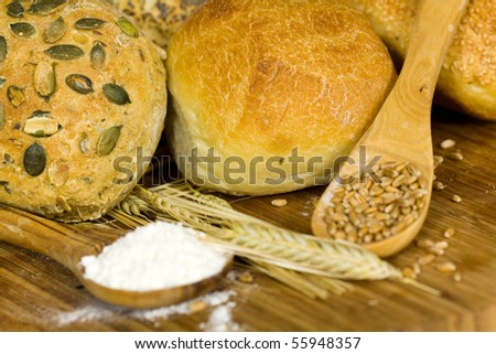 german roll bread with pumpkin and poppy seeds on the white background