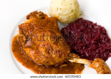 Roasted leg of  duck, red cabbage and potato dumplings