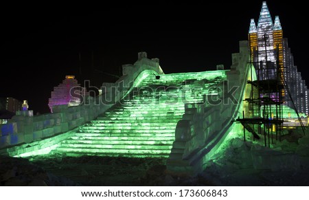 HARBIN, PEOPLE\'S REPUBLIC OF CHINA - DECEMBER 27: Ice bridge and sculptures at the 2014 Harbin Snow and Ice Festival shown on December 27, 2013 in Harbin, People\'s Republic of China.