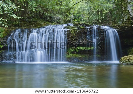 a waterfall in the forest, long time exposure