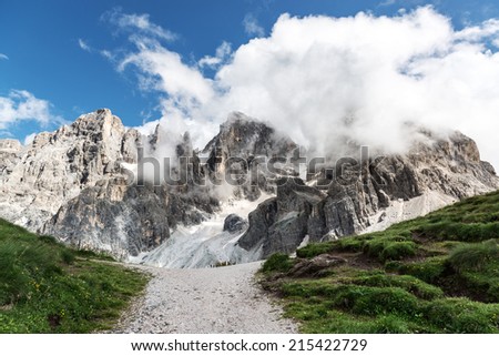 Dolomites, Pale di San Martino landscape in summer season with clouds - Italy