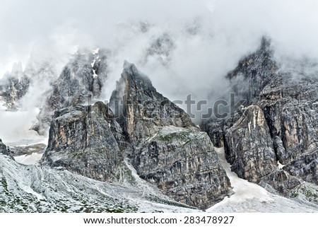 Storm clouds over the top of the mountains Pale di San Martino, landscape from Venegia Valley in a summer rainy afternoon, Trentino - Italy