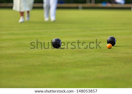 Ladies playing lawn bowls