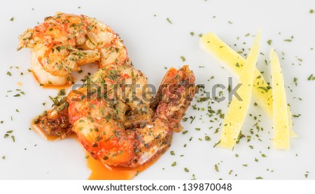 macro photograph of a prawn dish decorated with lemon