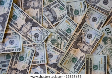 A disorderly pile of united states twenty dollar bills