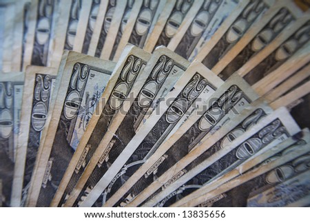 United States currency - stack of twenty dollars bills fanned out