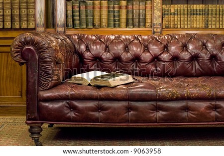 Retro sitting room with leather couch with book on it
