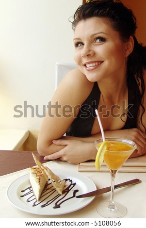 Girl in a restaurant interior. Served table.
