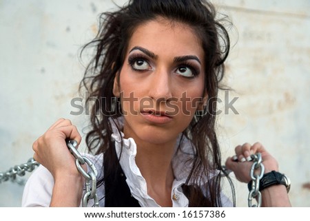 Pretty long - haired armenian girl with chains.