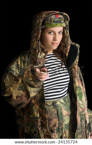 Portrait of woman in camouflage clothing. Isolated on black.