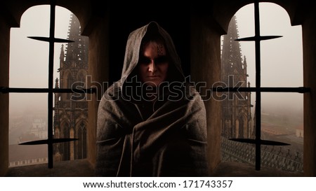 Mystery monk with the runes on the face. Sanctus Vitus church on the background.