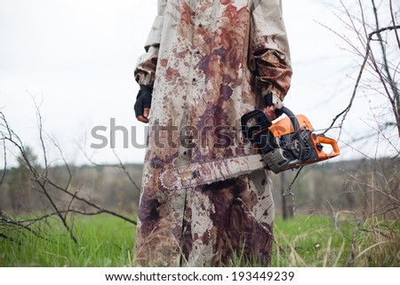 Maniac with the chainsaw dressed in a dirty bloody raincoat.