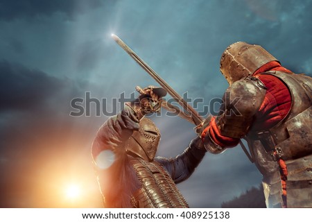 Battle of a Medieval knights on the sunset background.