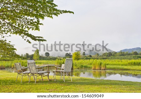 Set of chairs with table at mountain view
