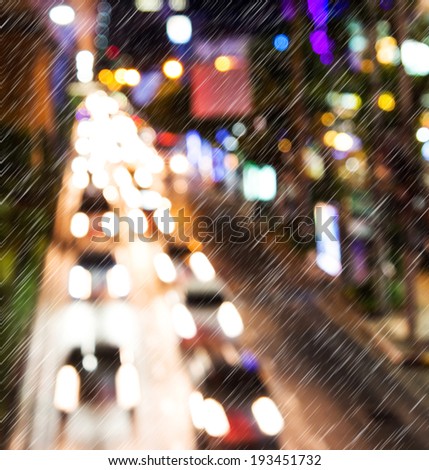 Light traffic on a rainy night. Motion blur.