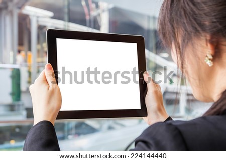 Businesswoman looking digital tablet. Space for your picture.