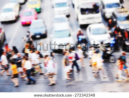 Abstract blur background of people are crossing road at the crosswalk