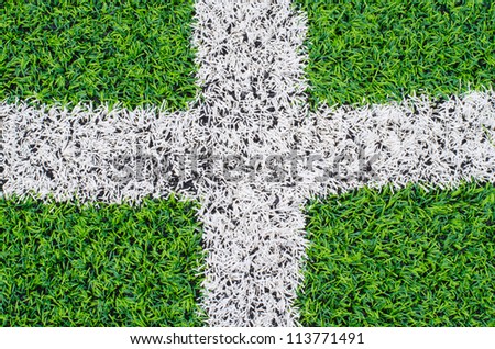 green synthetic grass sports field with white line  backgroubd
