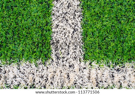 green synthetic grass sports field with white line  backgroubd