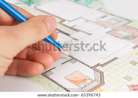 Interior designer draws house floor plan