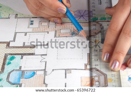 Architect draws a home plan
