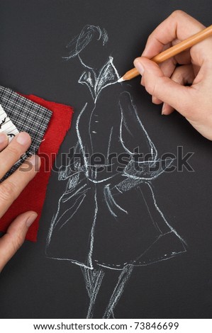 Fashion designer is drawing a fashion sketch