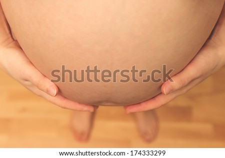 Pregnant\'s woman touching her belly with her hands/Pregnant Woman Belly