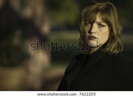 Blonde woman model with green eyes and a neutral expression