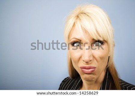 Businesswoman in a pinstripe suit making a funny face
