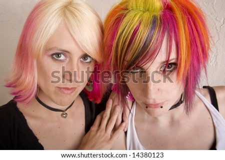 Two hip girls with brightly colored 
