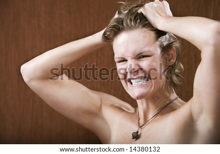 Portrait of a frustrated woman pulling her hair