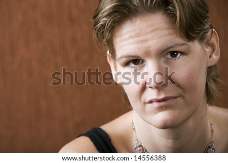 Attractive woman with a stern look on her face