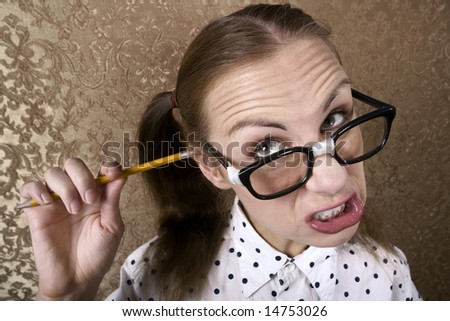 stock-photo-wide-angle-portrait-of-nervous-nerdy-girl-cleaning-her-ear-with-a-pencil-14753026.jpg