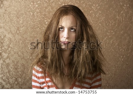 Portrait of a young woman with messy long hair