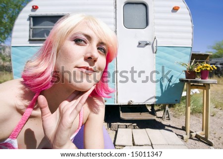 Pretty Woman Front of a Vintage Travel Trailer