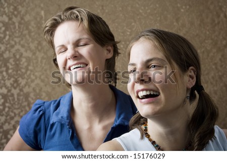 Portrait of Two Young Women Friends Laughing