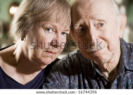 Close Up Portrait of Worried Senior Couple