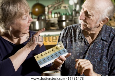 Portrait of Senior Couple Discussing Medications