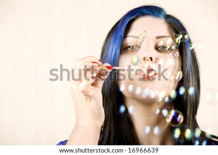 Pretty Woman with Big Eyes Woman Blowing Many Bubbles