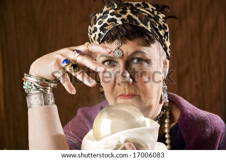 Female gypsy fortune teller with a crystal ball