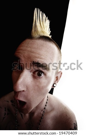 Surprised shirtless man with a Mohawk hair style
