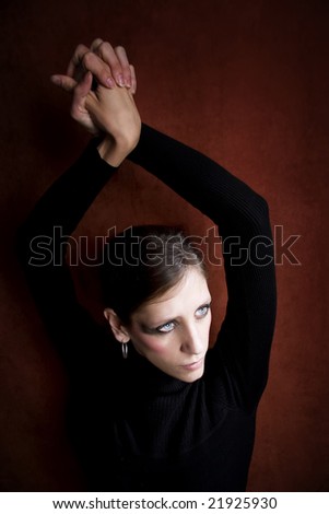 Beautiful Woman with in black hands above her head