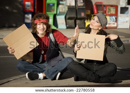 Attractive Young Man and Woman with Blank Cardboard Signs