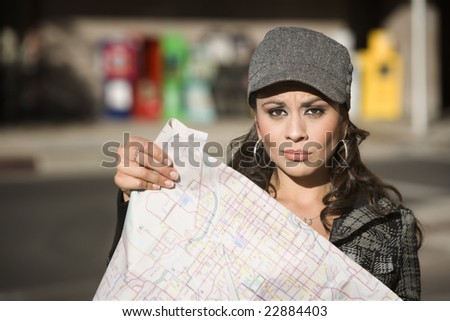 Lost Young Woman on the Sidewalk with Map