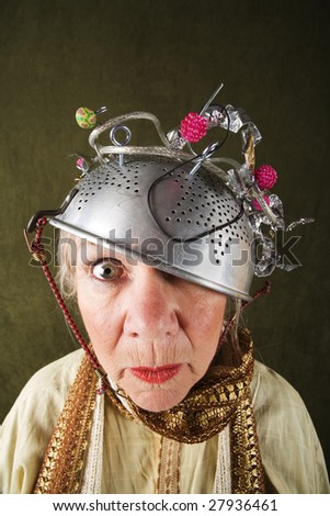 stock-photo-crazy-woman-wearing-a-metal-colander-for-a-helmet-27936461.jpg