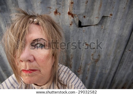 Senior homeless woman with too much makeup