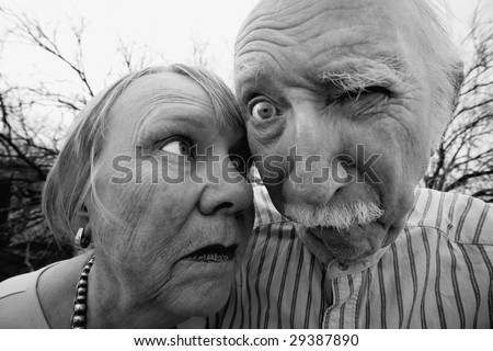 Closeup portrait of crazy elderly couple outdoors