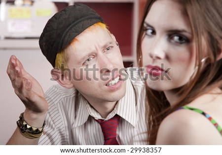 Young man confused by disagreement with pretty woman
