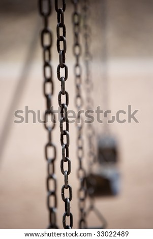 Chain on an old style playground swing