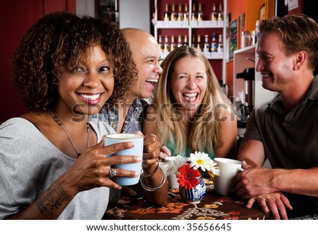 stock-photo-pretty-african-american-woman-in-coffee-house-with-friends-35656645.jpg